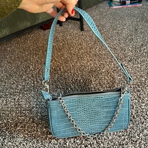 Blue purse from Urban Outfitters with chain